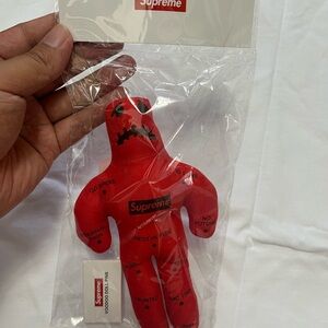 supreme voodoo doll red